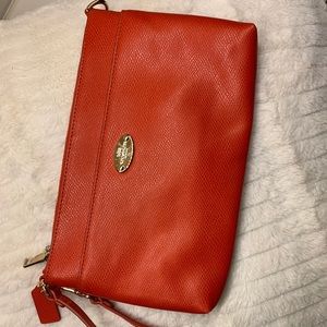 Coach clutch in red/orange color